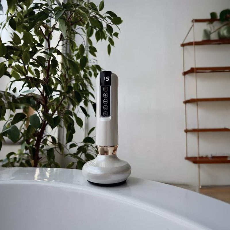 Masseur électrique corps Dermaluxe Nusika posé dans une salle de bain